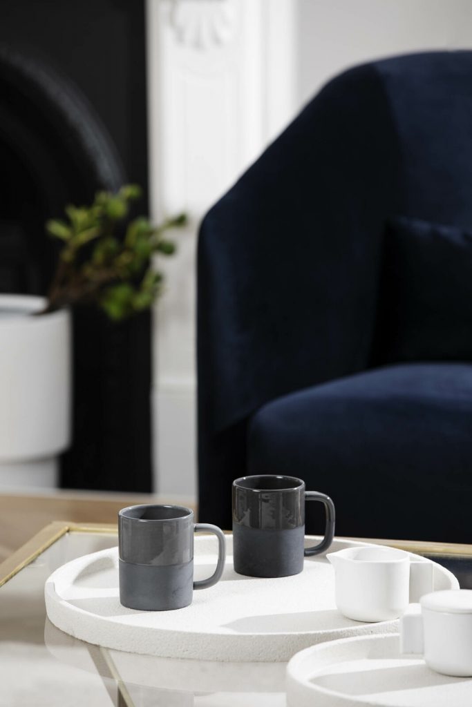 perfectly decorated living room with unique coffee mugs