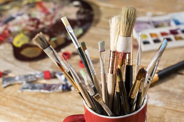 mug with different artist brushes